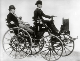 Gottlieb Daimler sitting in a motor vehicle - LOC