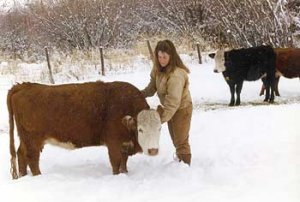 Heather's daughter Andrea, and one of her crossbred Angus-Hereford cows, named Norman