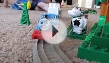 Thomas the train carries blocks past farm animals